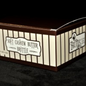 8 oz Soft Cashew Butter Brittle Box in a brown box with tan stripes