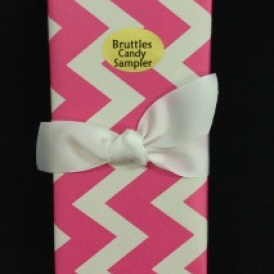 Medium Sampler in a pink chevron gift wrapped box with a white ribbon