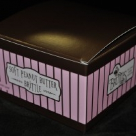 16 oz Soft Peanut Butter Brittle in a pink and brown stripped box
