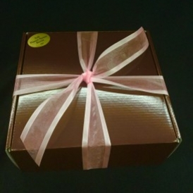 3# Soft Peanut Butter Brittle in a black box with gold ribbon